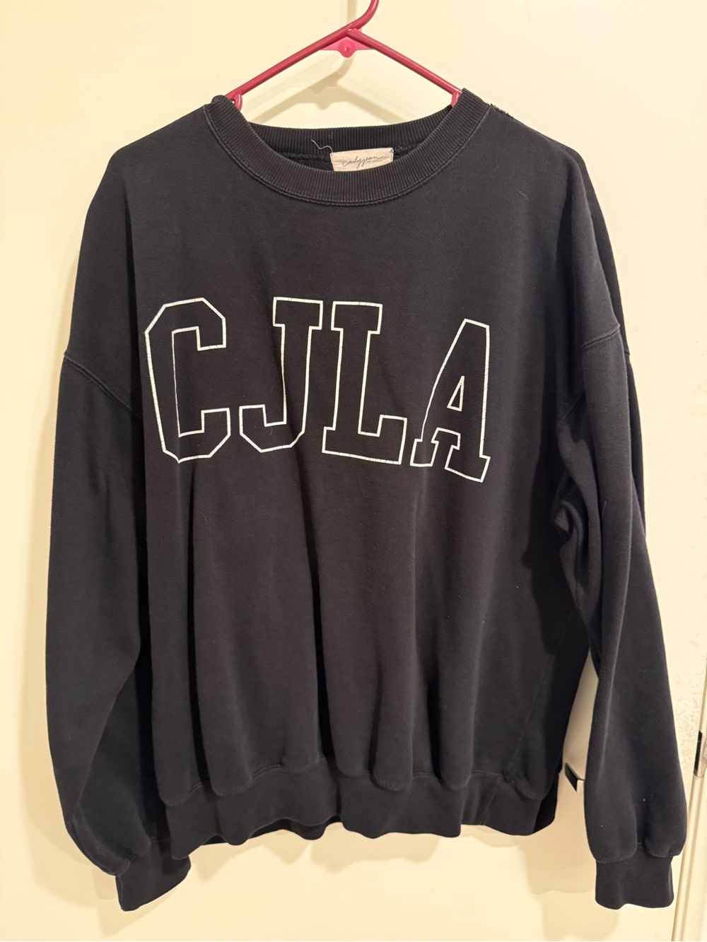 Carly Jean Los Angeles Black Crewneck Sweater with White CJLA Letters